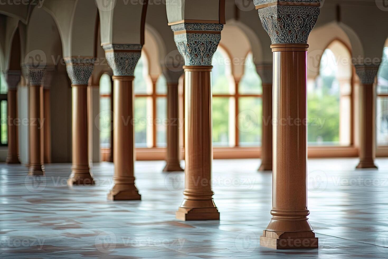 Ornate columns in a grand hall with arched windows and tiled floor. photo