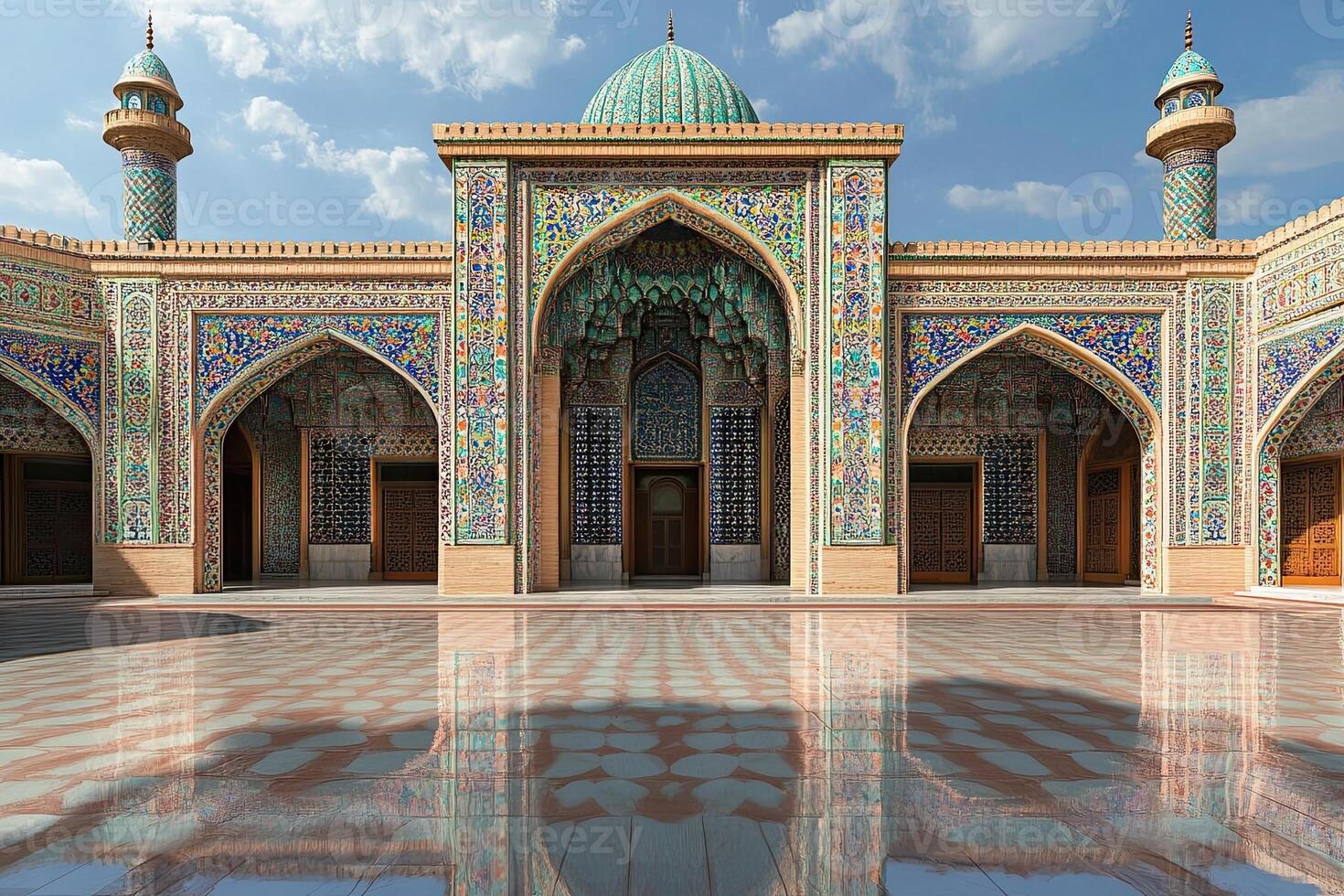 Ornate mosque courtyard with intricate tilework and minarets under a sunny sky. photo