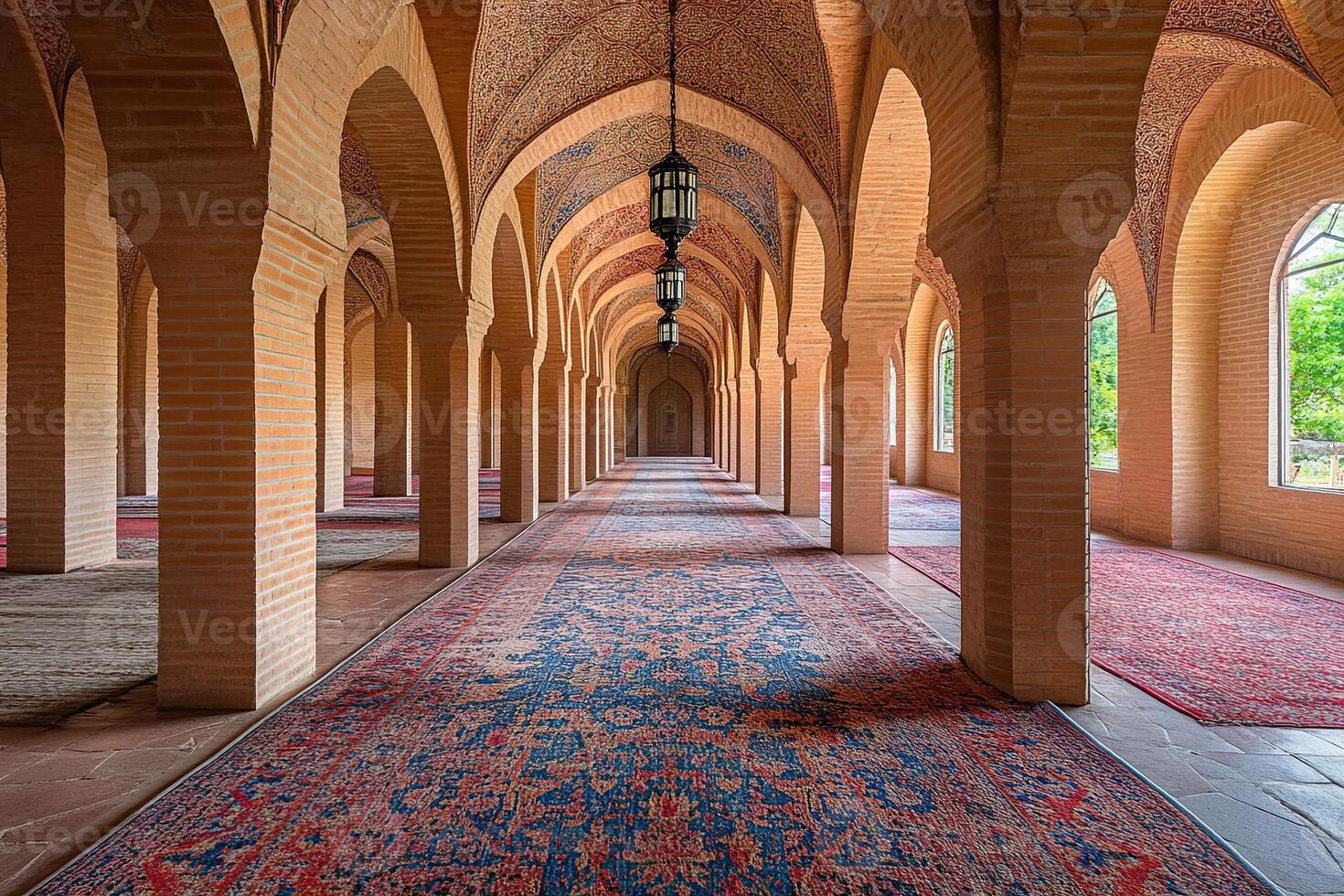 Serene mosque hallway with arched columns, intricate rugs, and natural light. photo