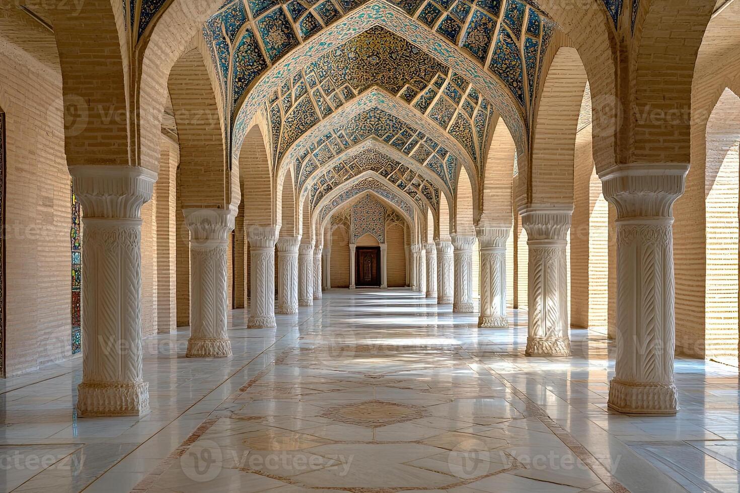 Sunlit arcade with ornate columns, arches, and mosaic ceiling. photo