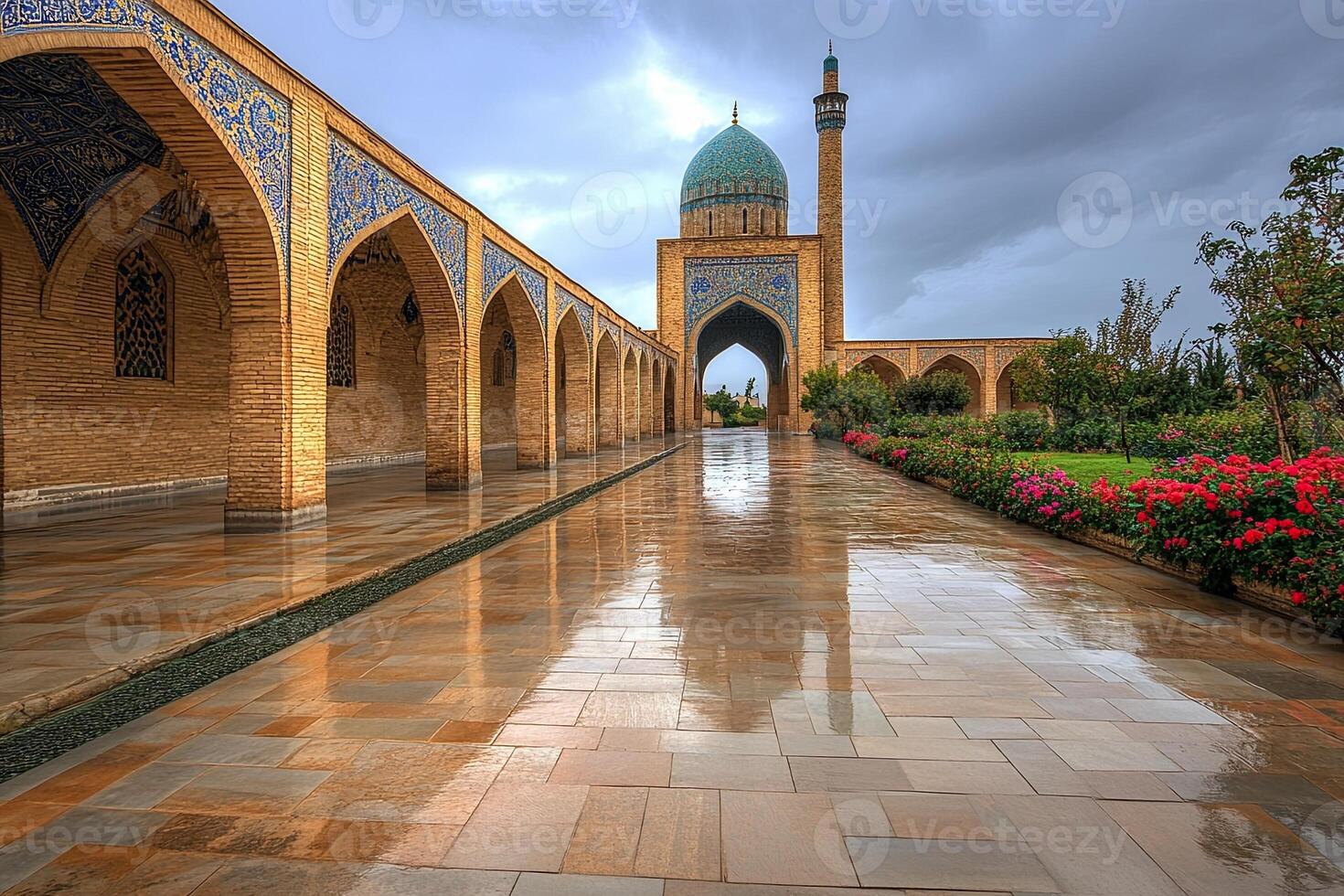 Wet stone walkway leading to a mosque with blue dome under a cloudy sky. photo
