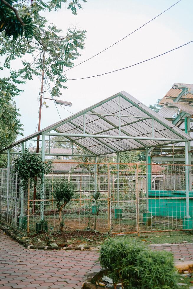 reenhouse structure for trees, covered solely by alderon roofing. photo