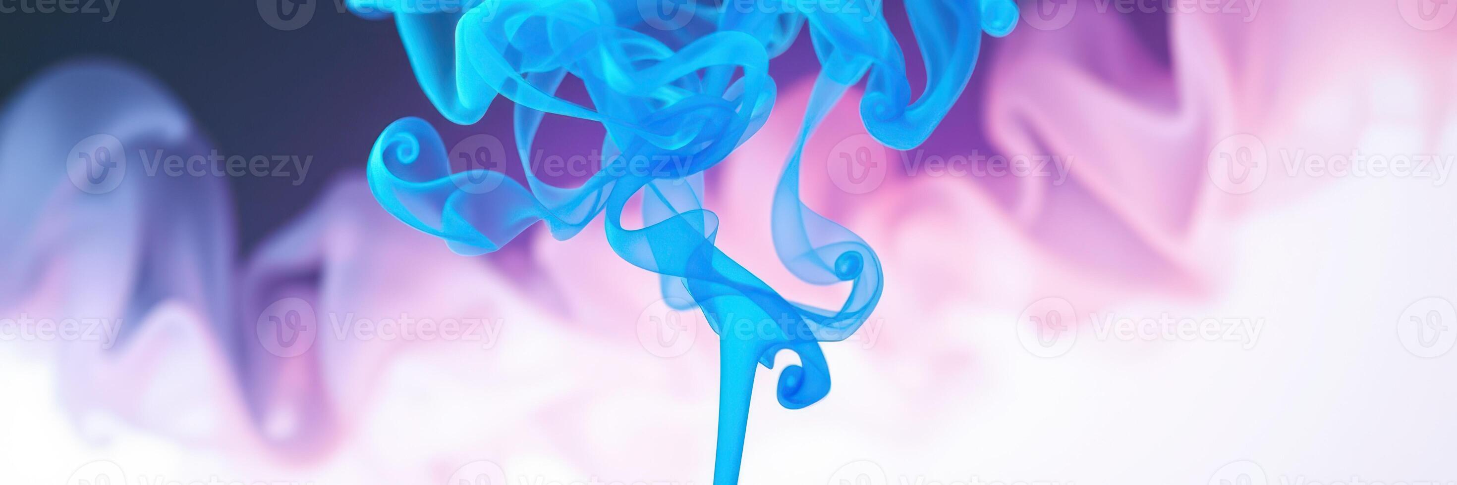 Colorful blue smoke swirls gracefully against a background of soft pink and white hues photo