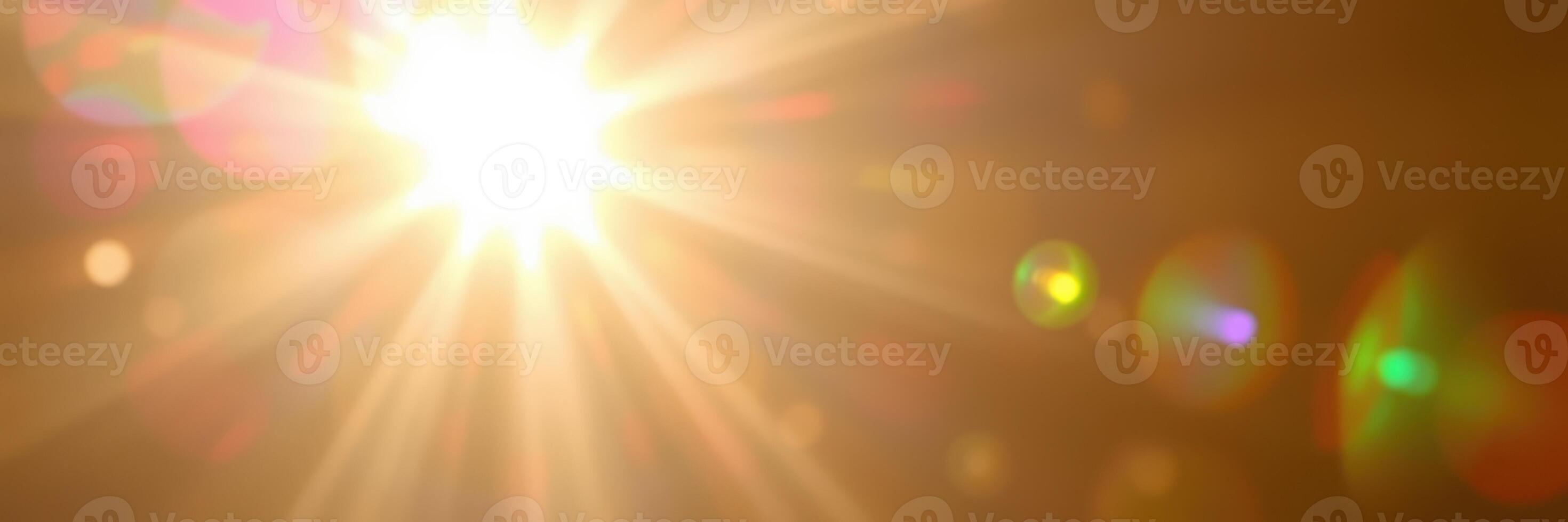 Bright sunlight beams through a clear sky, creating a vibrant glow and illuminating the surroundings in the early morning hours photo