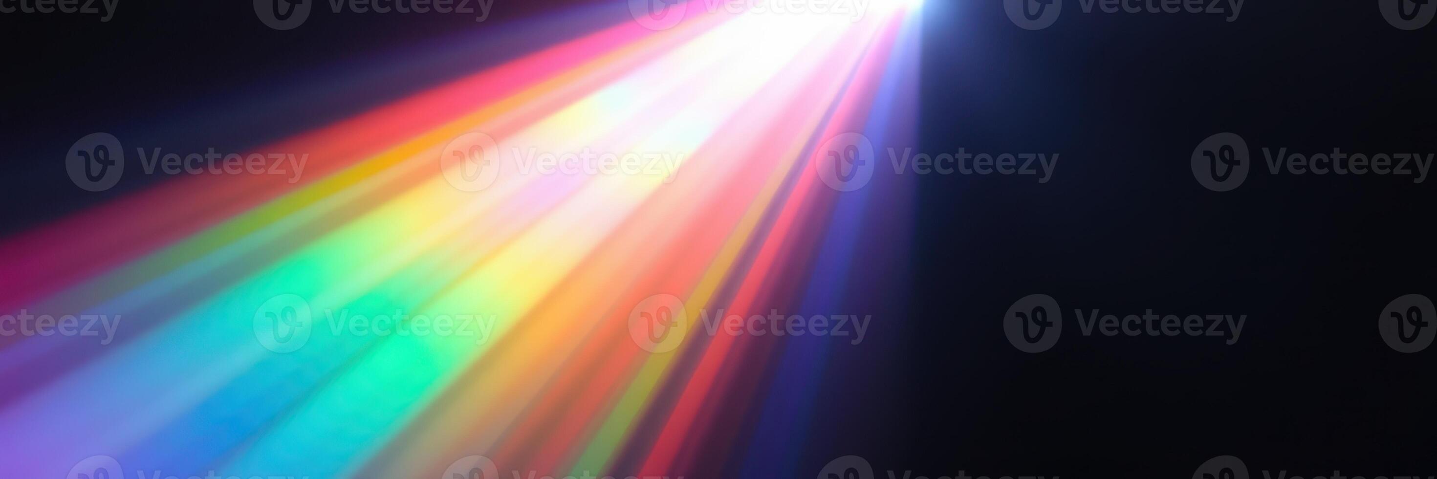 Colorful light beam illuminating darkness while creating a vibrant display of rainbow hues photo