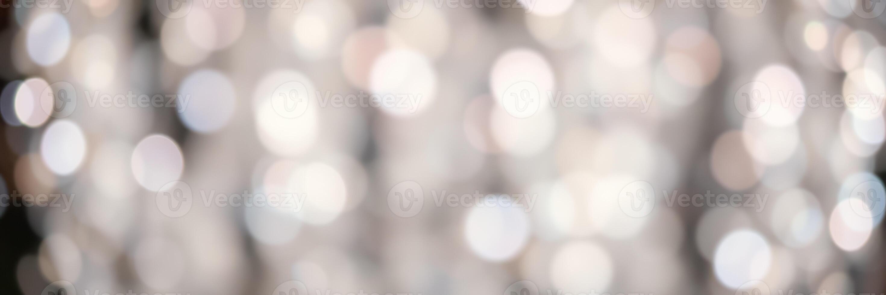 Soft bokeh lights create a dreamy atmosphere in a festive indoor setting during evening hours photo