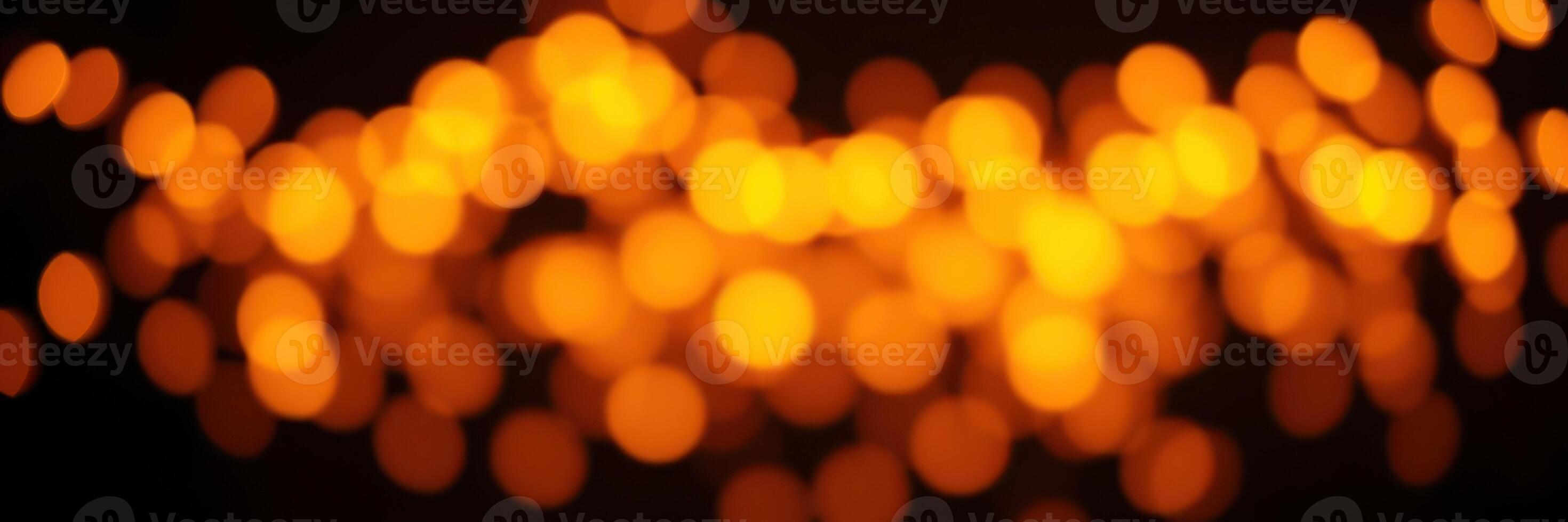 Warm golden bokeh lights create a dreamy atmosphere in a softly lit space during evening hours photo
