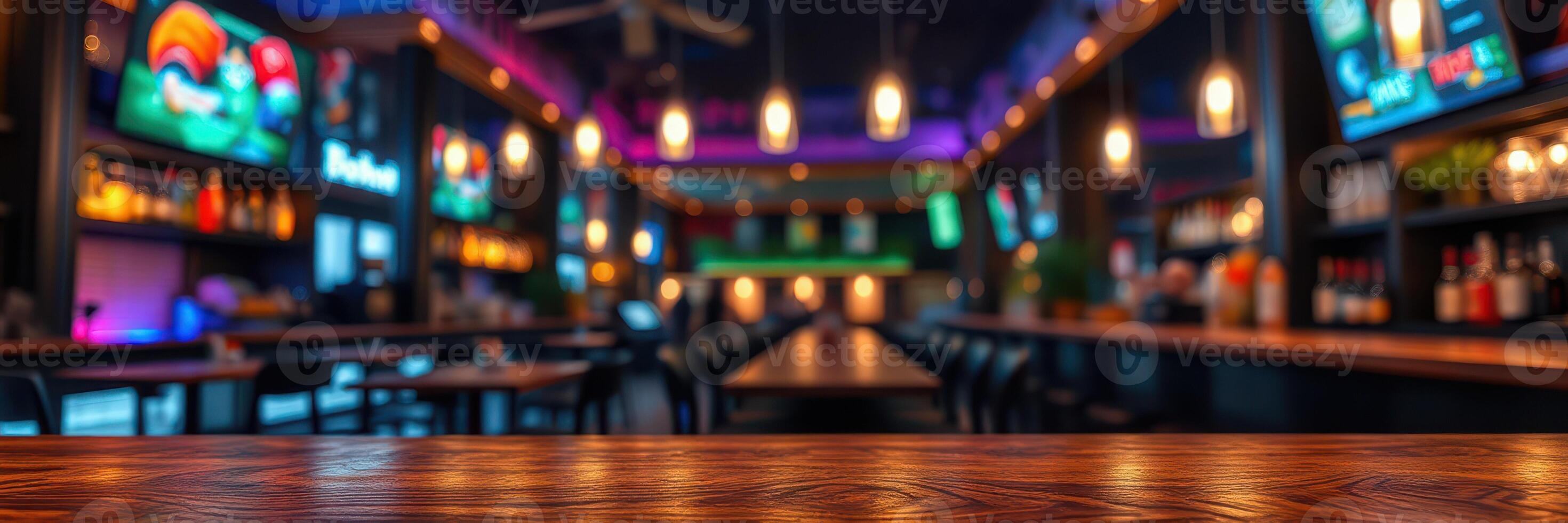 Modern bar interior with vibrant lighting and multiple screens showcasing sports events during evening hours photo