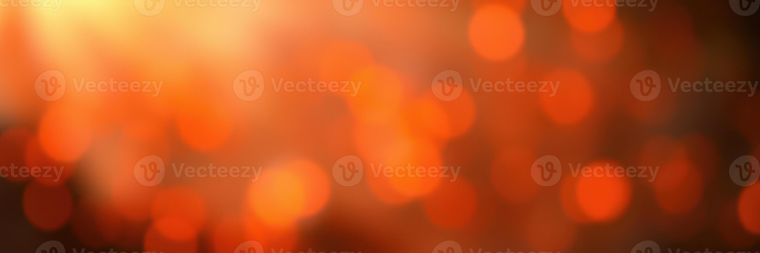 Vibrant orange and red bokeh lights create a warm atmosphere during a festive evening gathering photo