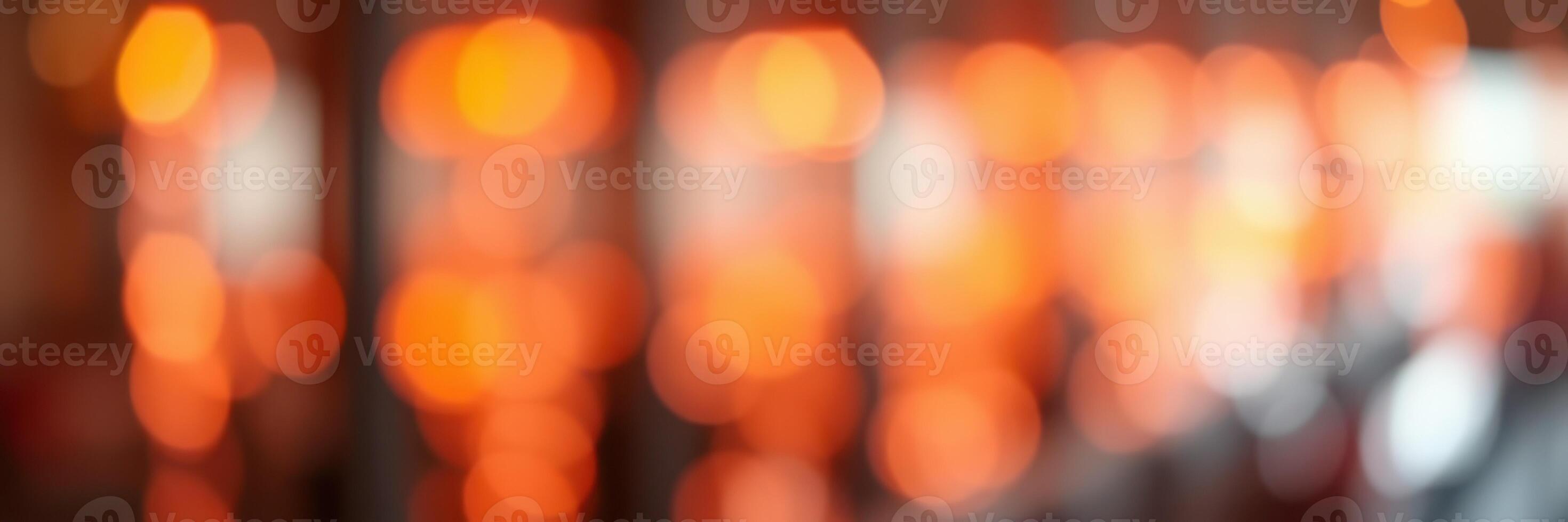 Warm glowing lights create a cozy atmosphere in a bustling urban setting at dusk photo