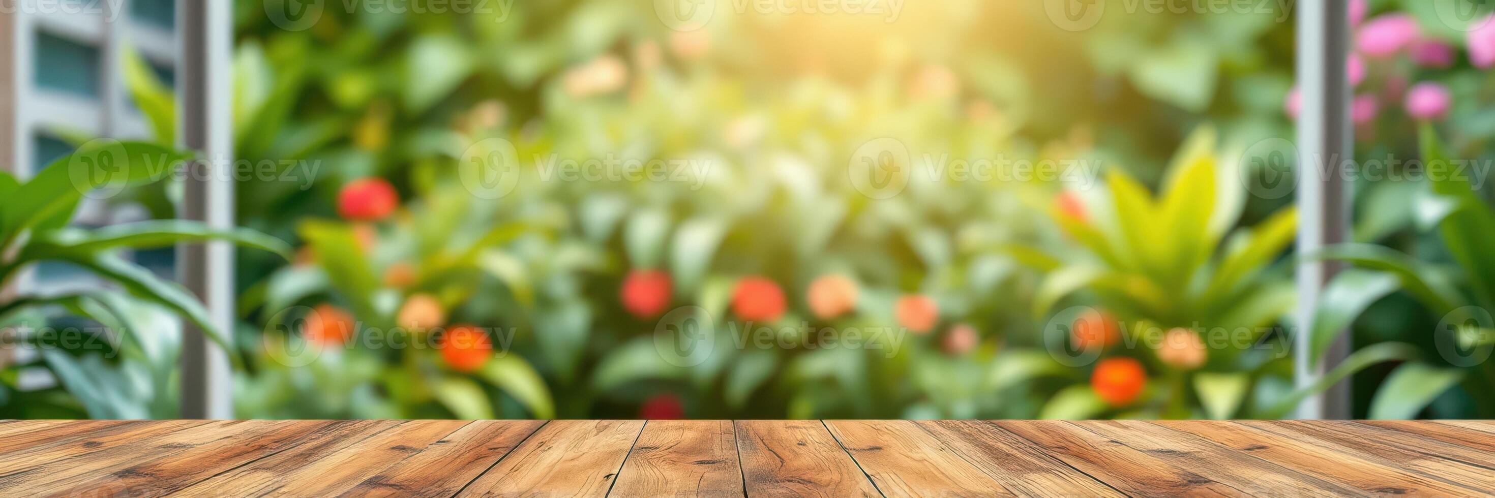 Beautiful garden setting with sunlit wooden table and vibrant flowers in the background during a peaceful afternoon photo