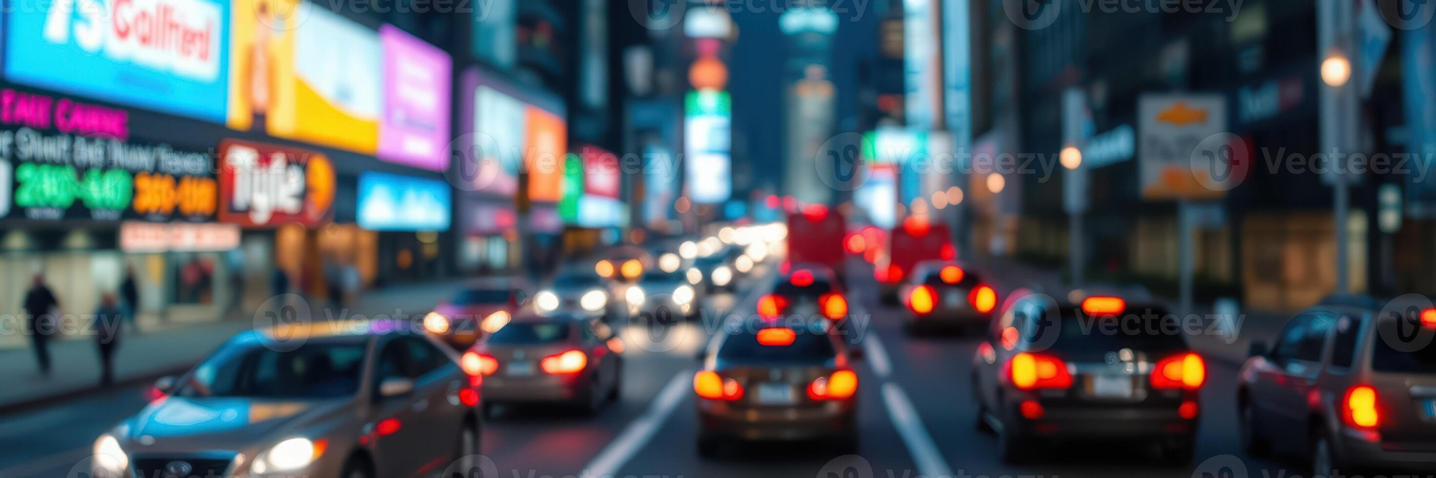 Traffic and vibrant lights in a bustling urban center during the evening rush hour photo