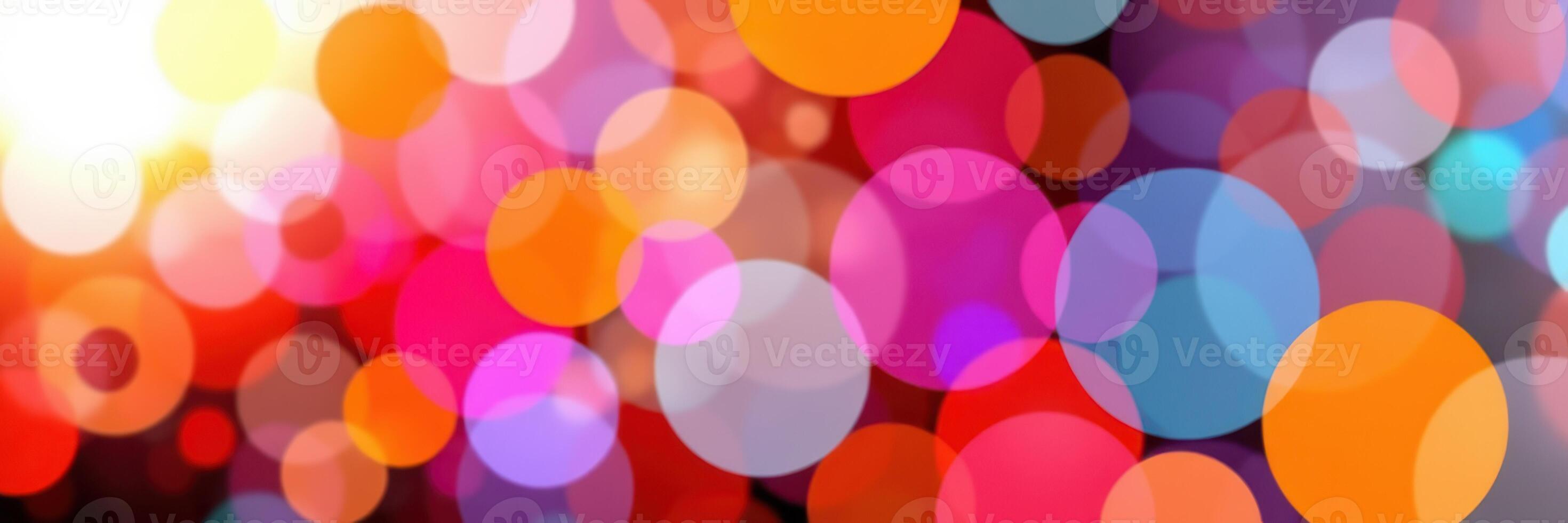 Colorful bokeh lights create a vibrant atmosphere at a festive evening celebration in a lively urban setting photo