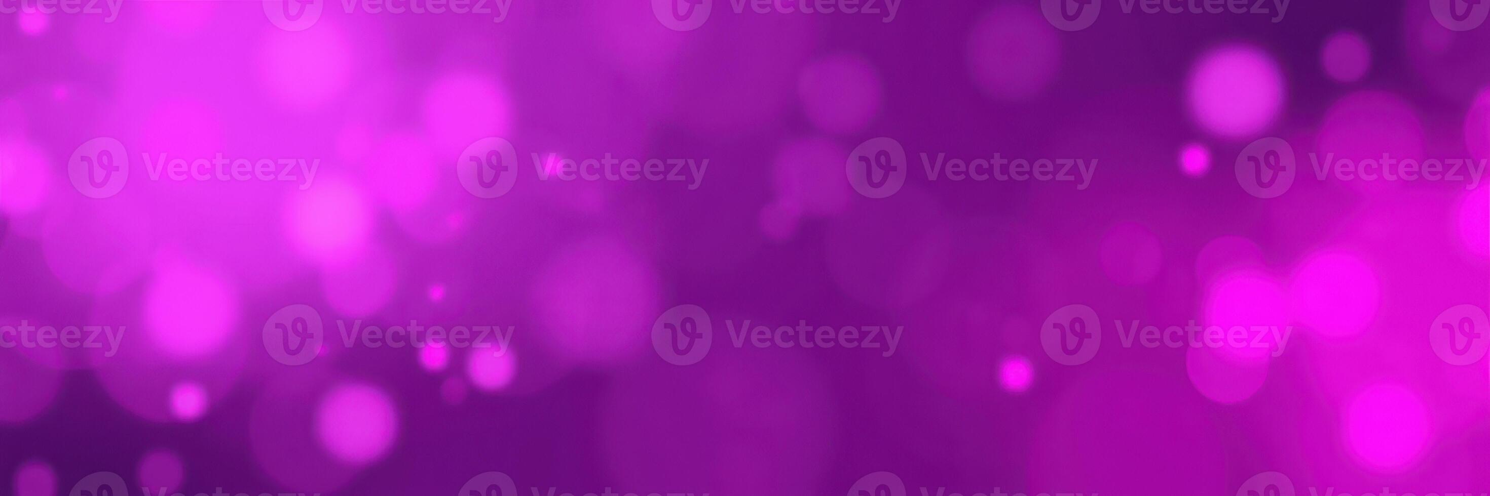 Vibrant purple bokeh lights create a dreamy atmosphere at a festive event during the evening photo