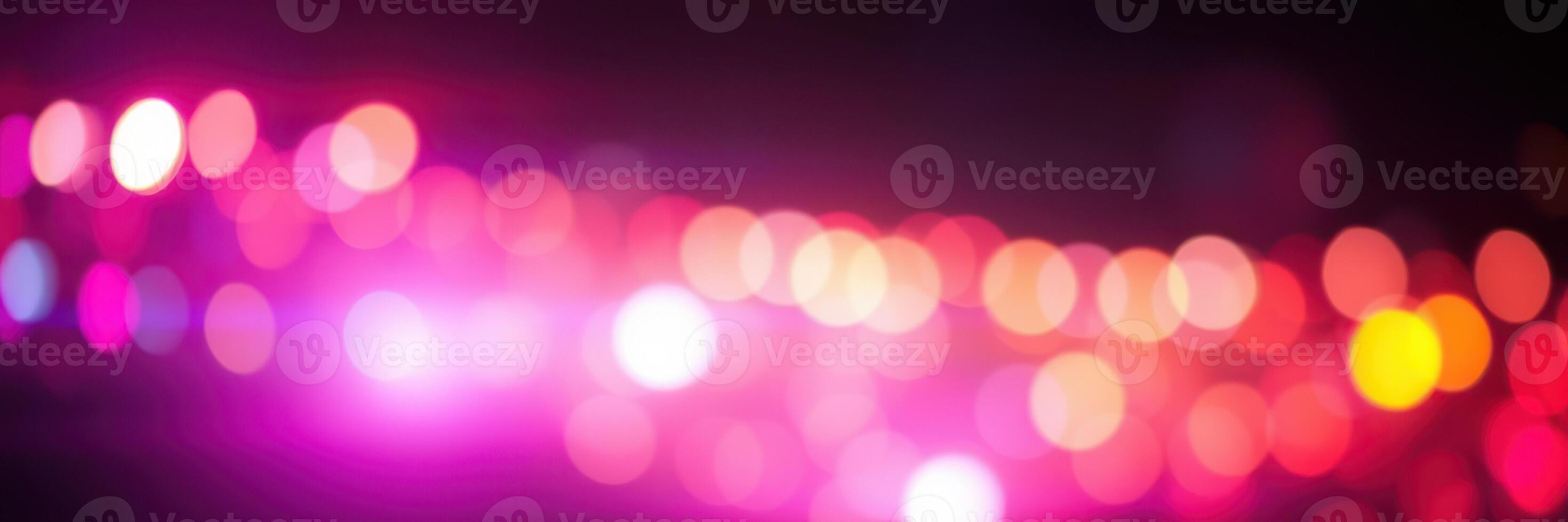 Colorful bokeh lights create a vibrant atmosphere during a night event in the city photo