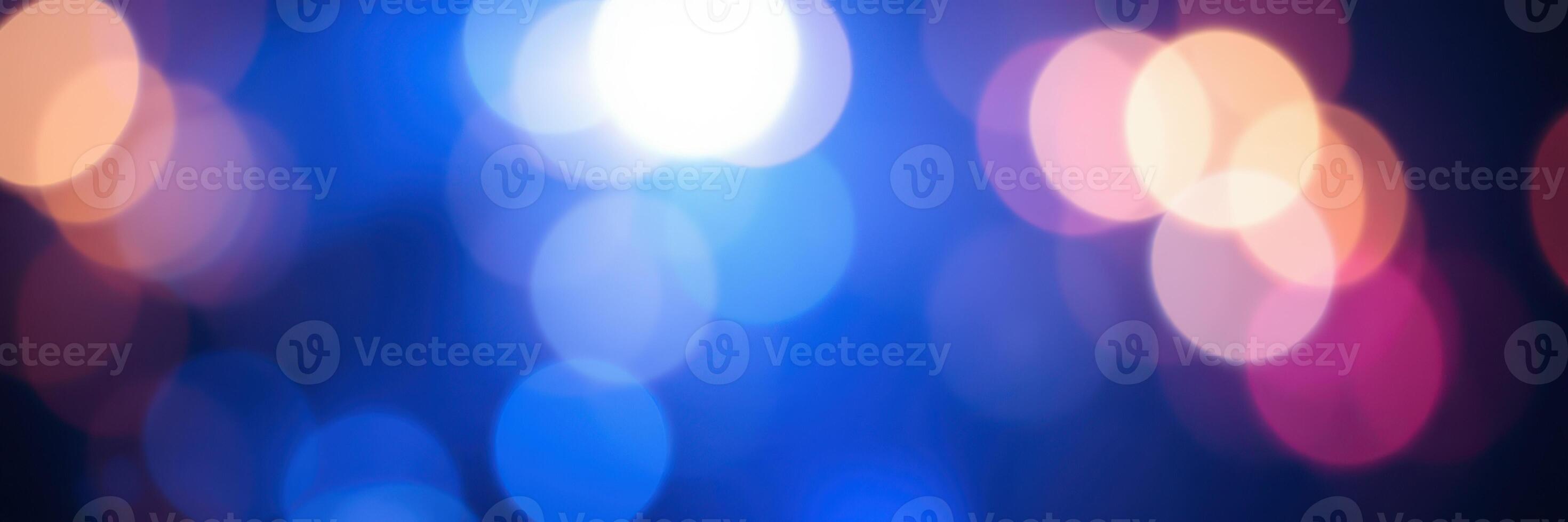 Colorful bokeh lights create a vibrant atmosphere in a lively urban setting at night photo