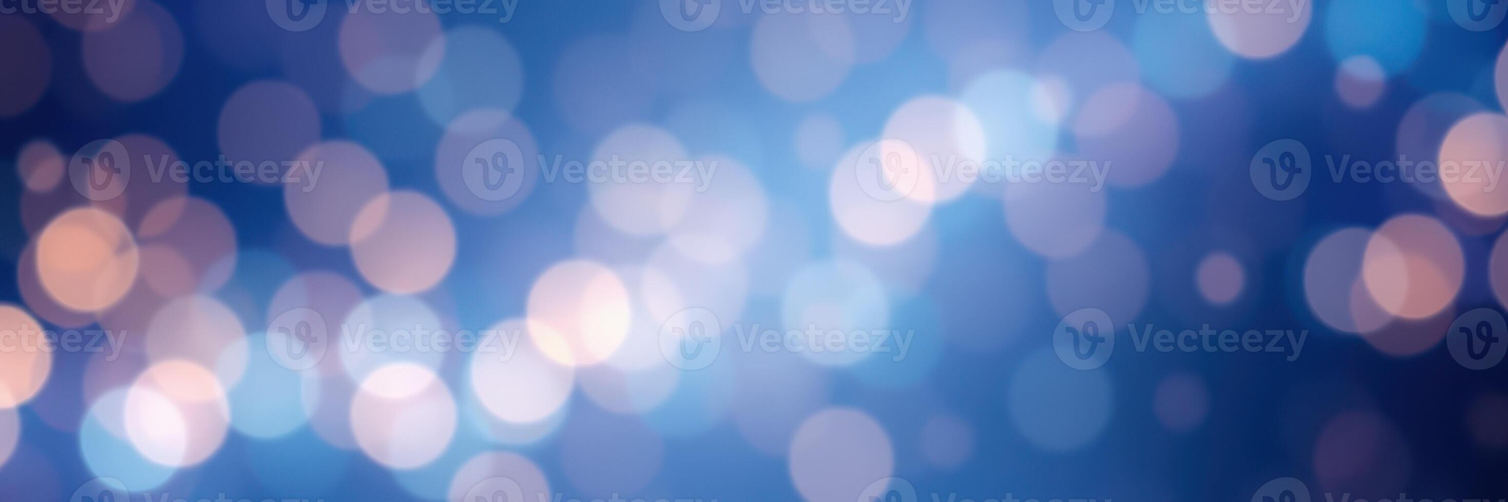 Soft blue background with glowing bokeh lights creating a serene and calming atmosphere for various creative uses photo