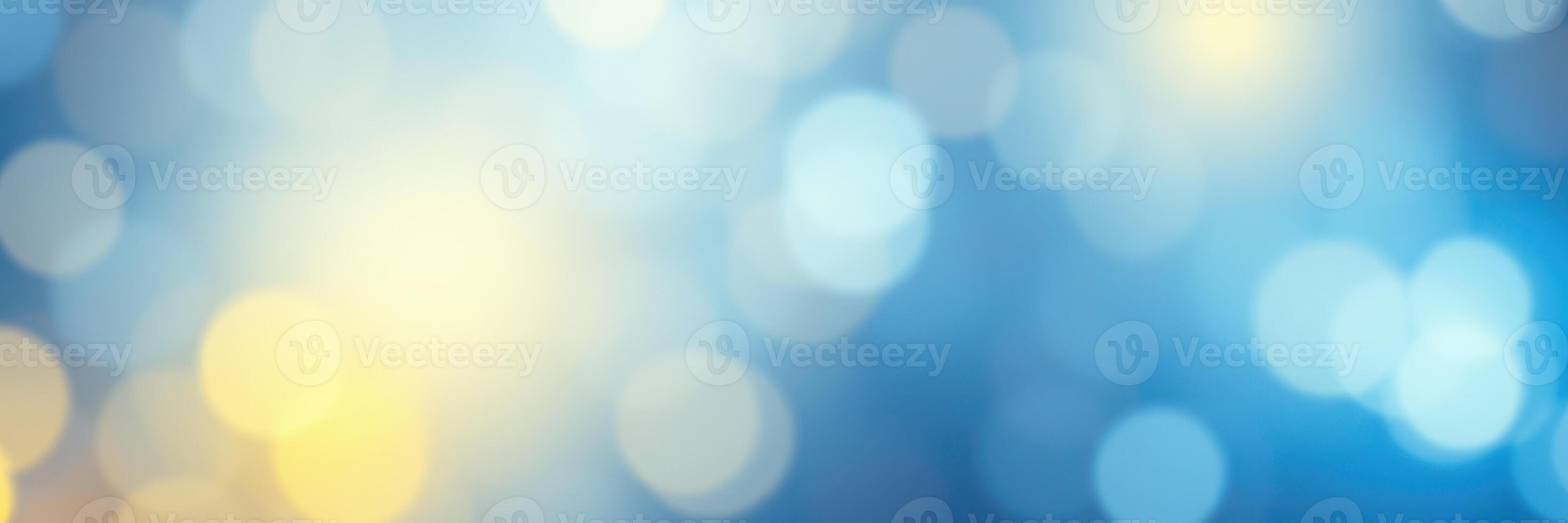 Beautiful blue and yellow bokeh lights create a soft and dreamy background for artistic projects or celebrations photo