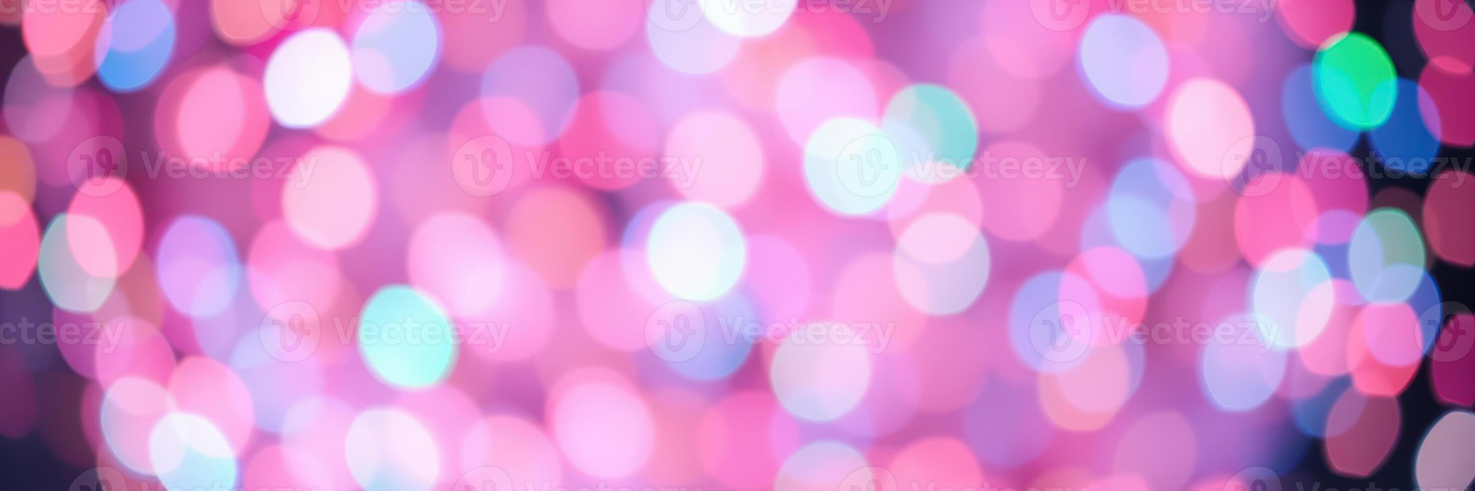 Colorful bokeh lights create a vibrant atmosphere during a nighttime celebration photo