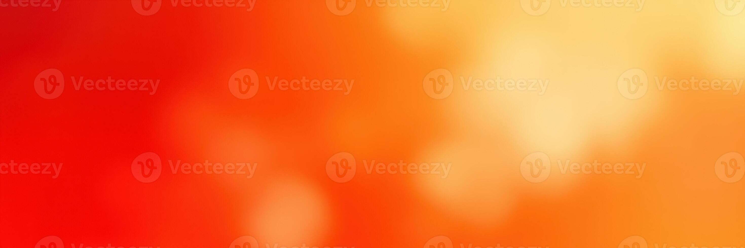 Bright orange and yellow abstract background with soft bokeh dots creating a warm atmosphere in the image photo