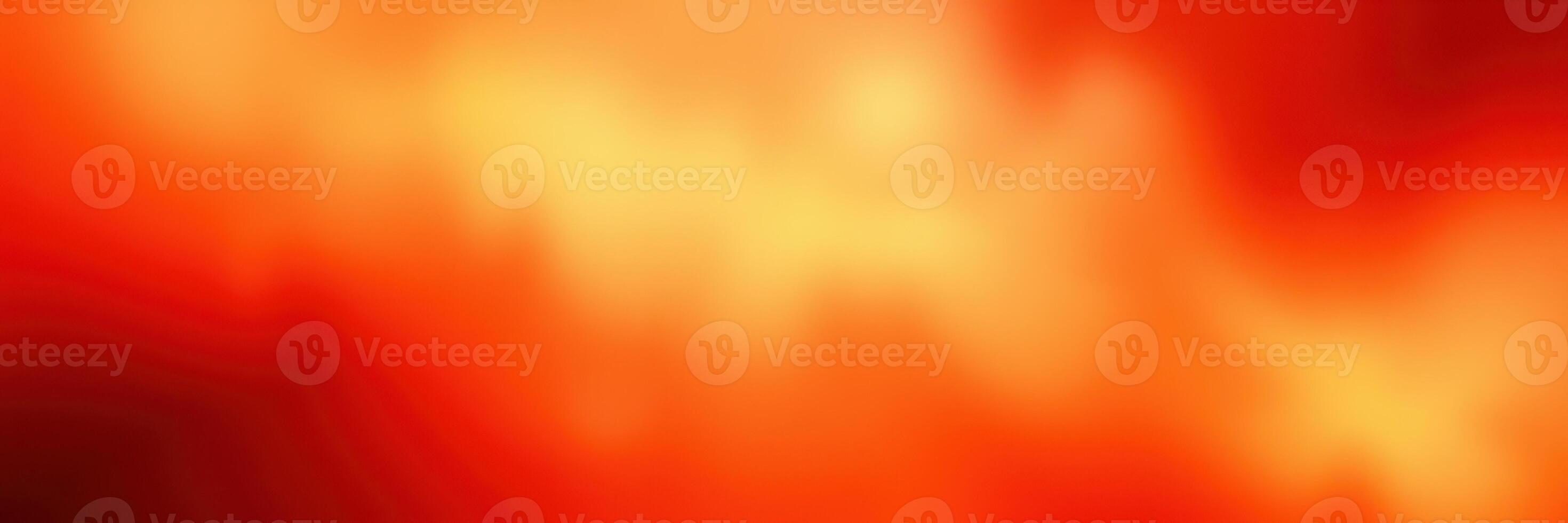 Vibrant orange and yellow abstract background resembling a warm sunset on a calm evening photo
