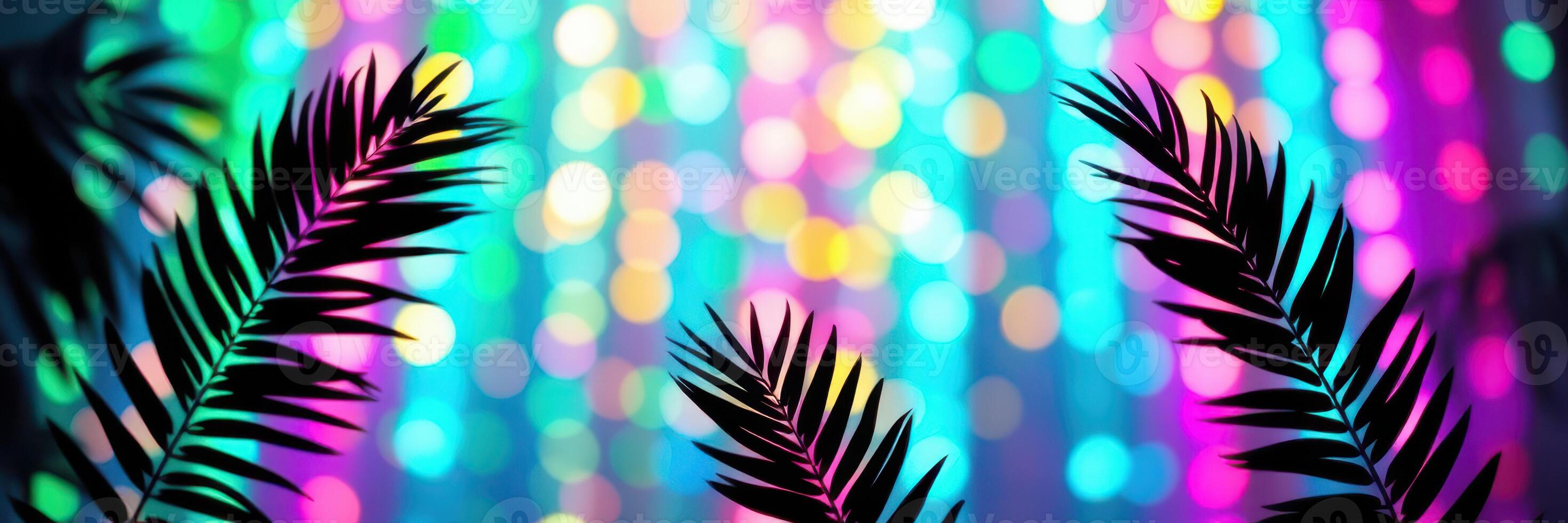 Colorful bokeh lights create a vibrant background with palm leaves in the foreground during a festive party atmosphere photo