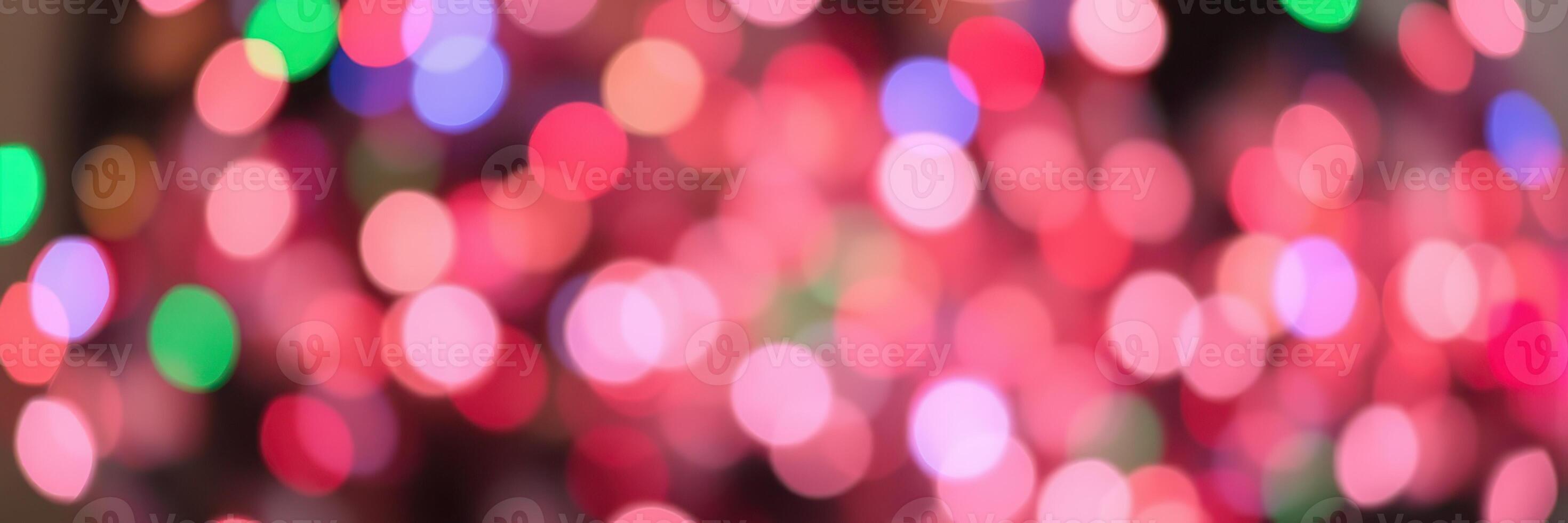 Colorful blur of holiday lights creating a festive atmosphere for celebrations and gatherings in a cozy setting photo