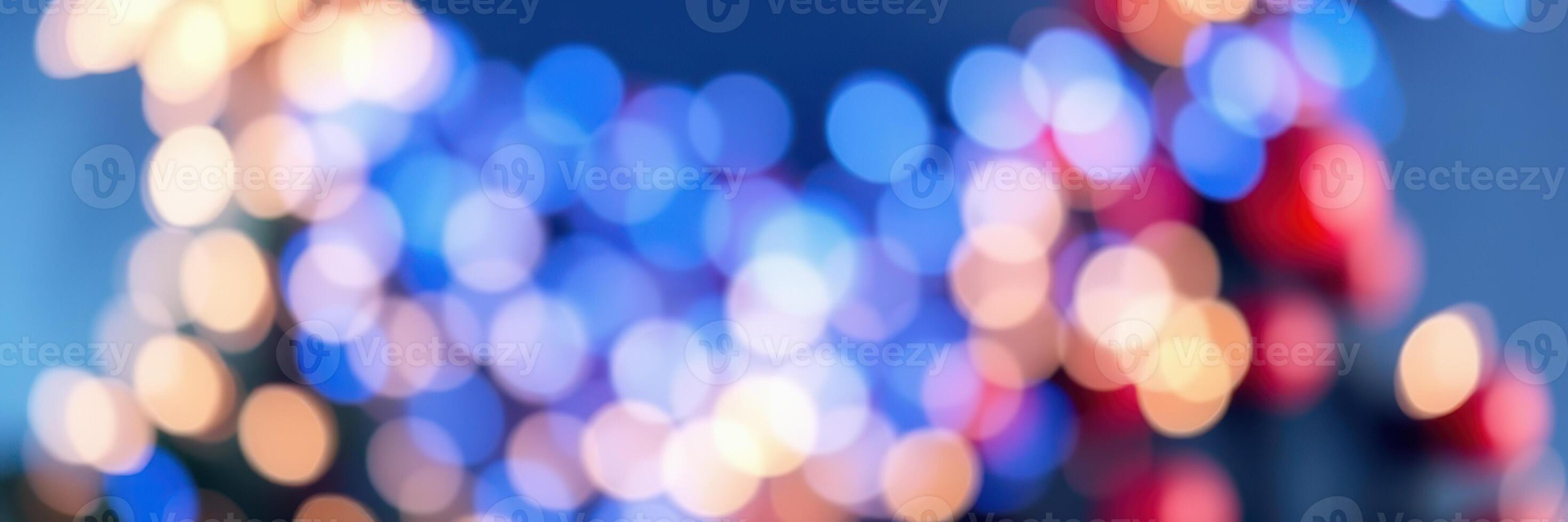 Colorful holiday lights illuminate a festive backdrop in a vibrant city setting at night photo