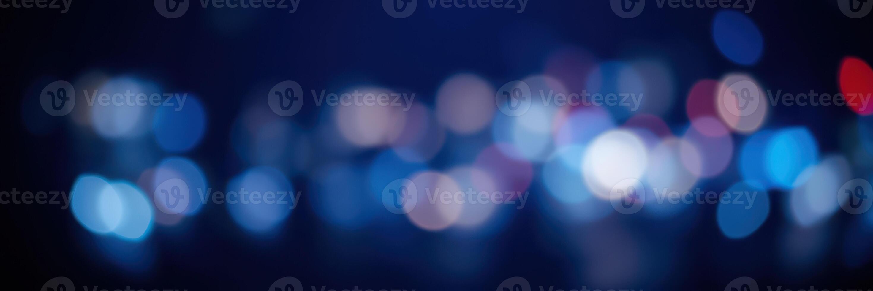 Vibrant city lights create a mesmerizing bokeh effect during nighttime urban exploration photo