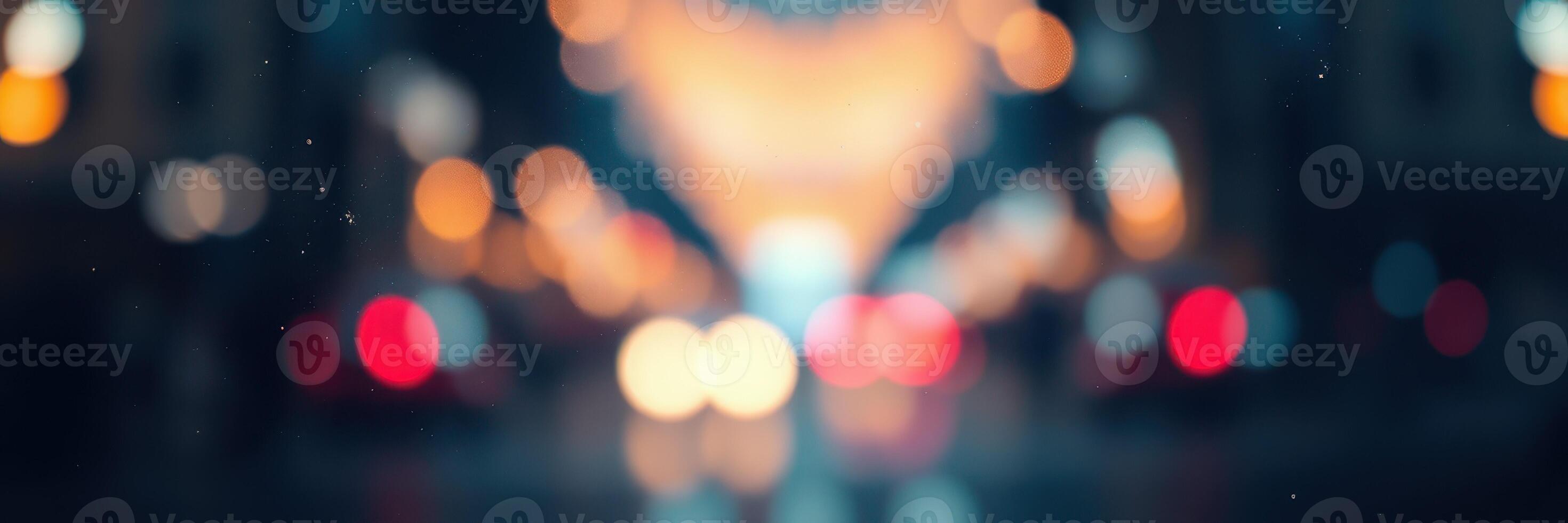 Colorful city lights illuminate a busy street at dusk with blurred car headlights creating a vibrant atmosphere photo