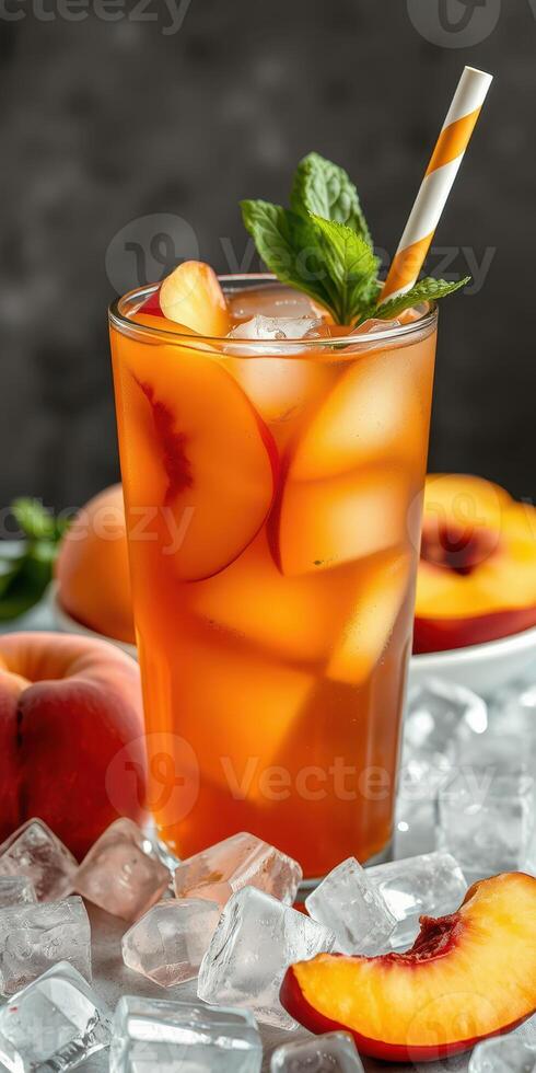 Refreshing peach iced tea served in a tall glass with mint garnish and ice photo