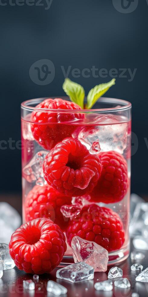 Refreshing raspberry drink garnished with mint leaves on ice photo