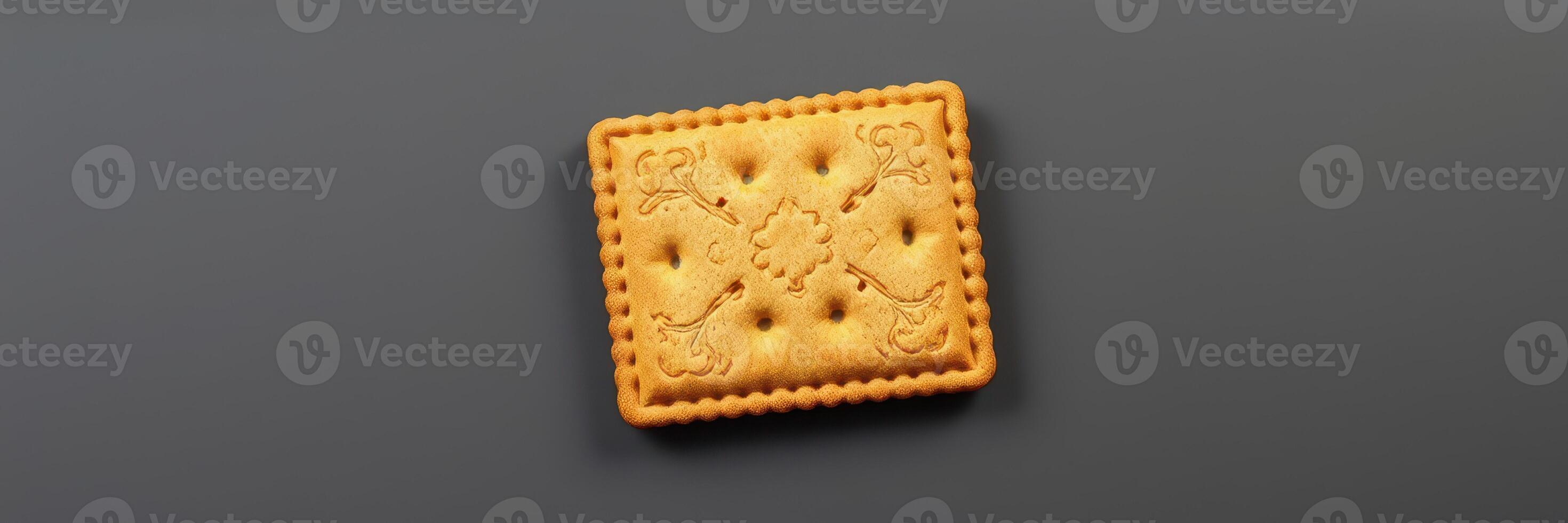 Delicious golden biscuit on a dark background showcasing its unique texture and design for a tempting treat photo