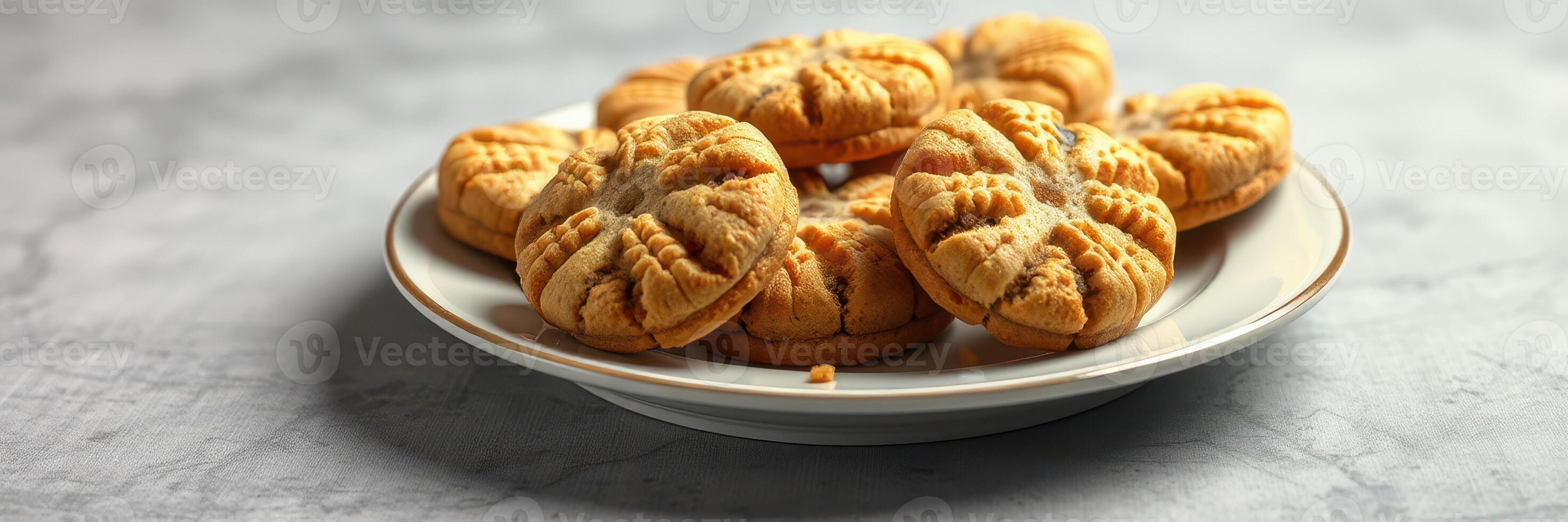 Freshly baked peanut butter cookies on a decorative plate ready to be enjoyed photo