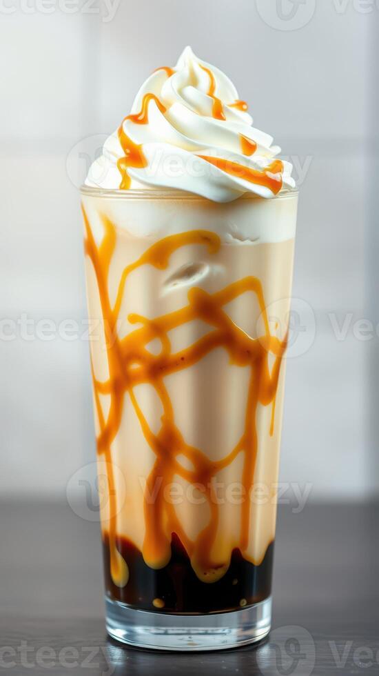 Delicious caramel iced coffee topped with whipped cream and caramel drizzle at a cafe photo