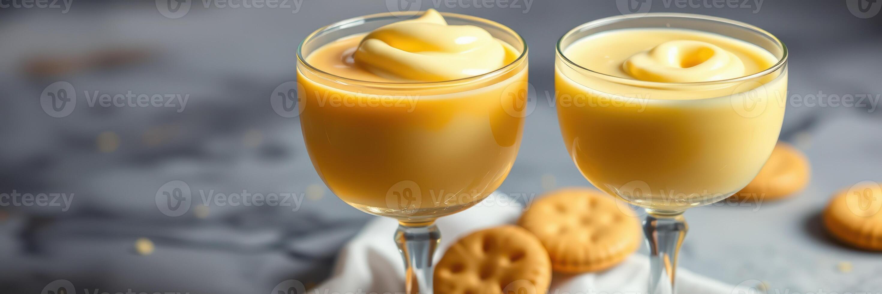 Delicious vanilla custard served in elegant glasses beside freshly baked cookies photo
