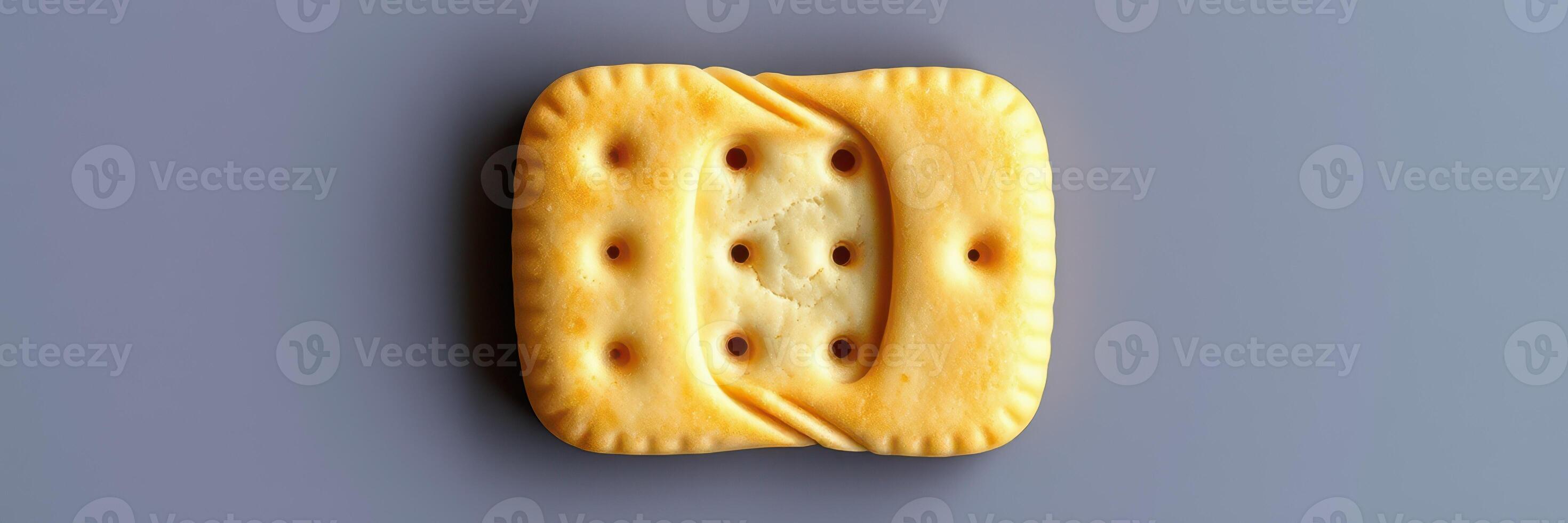 Unique cracker with distinct texture and shape on a light background showcasing its baked details and design photo
