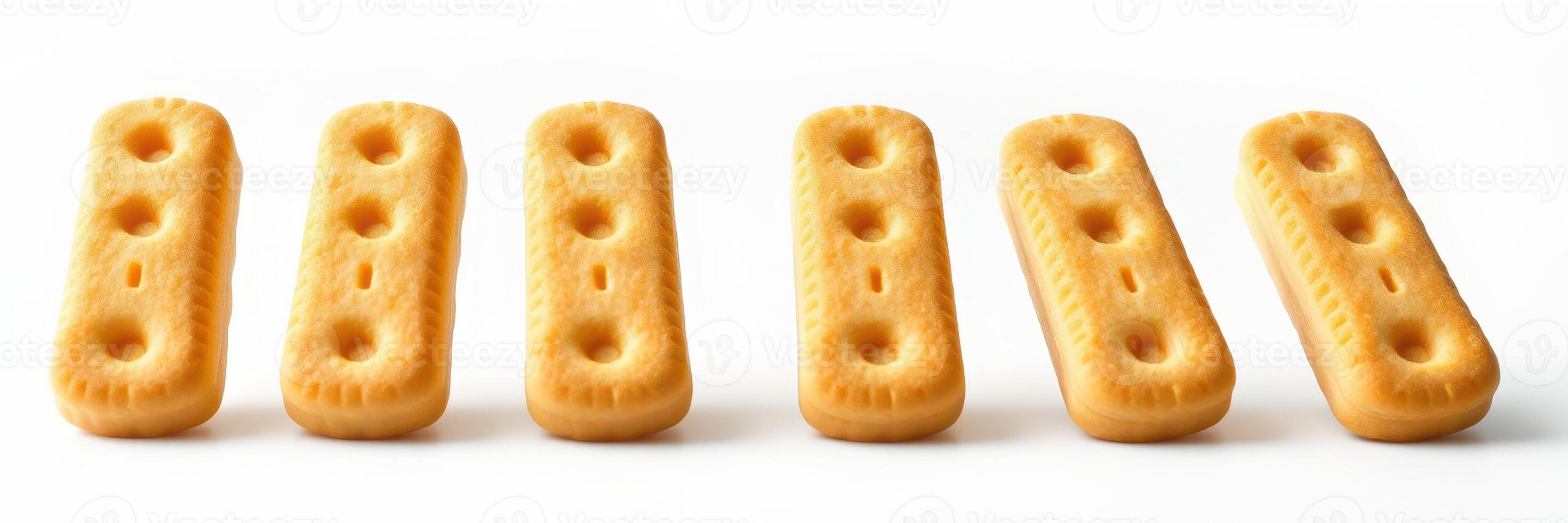 Crunchy rectangular cookies lined up on a white background ready for a snack or dessert photo