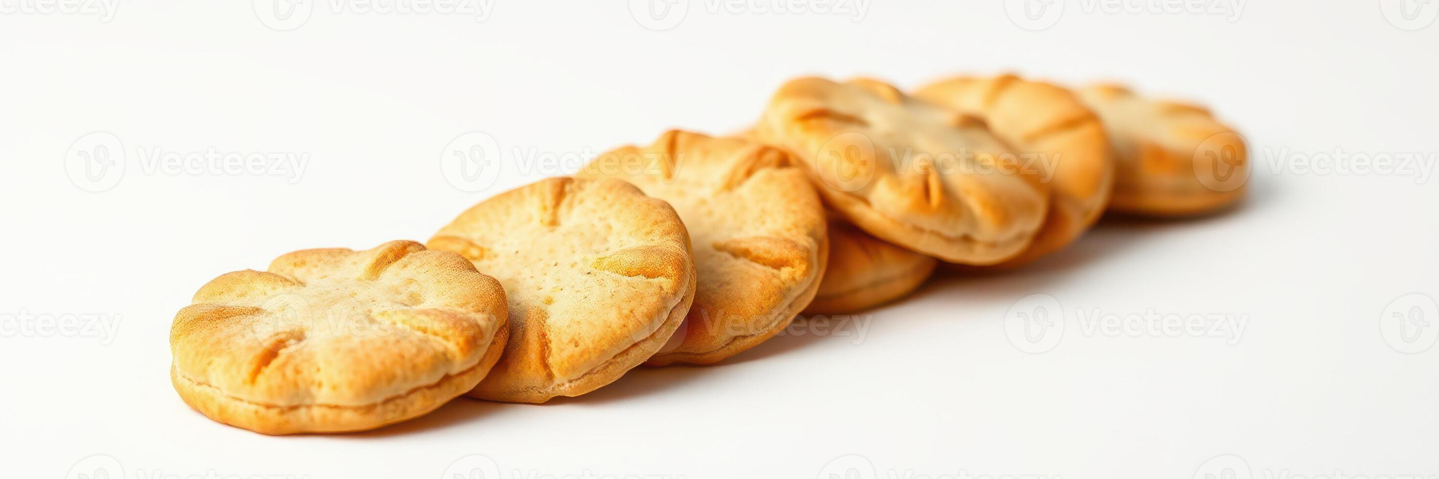 Delicious round cookies lined up on a white surface ready for enjoyment photo