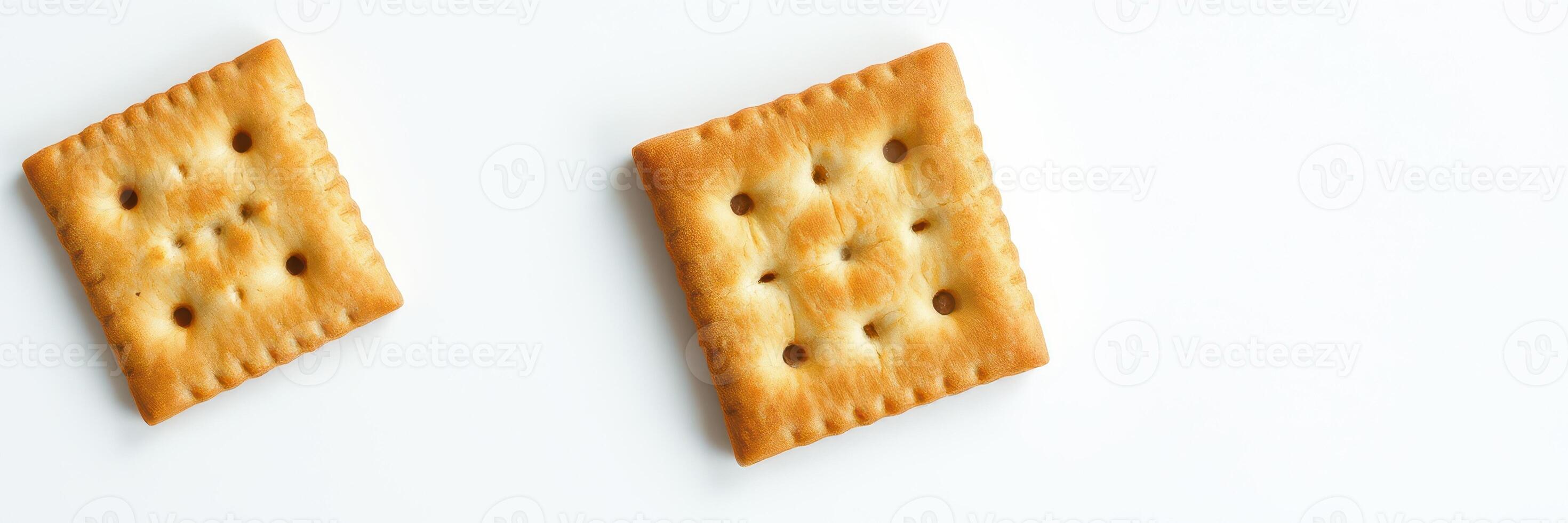 Delicious crunchy crackers arranged on a clean white surface perfect for snacking or serving with dips photo