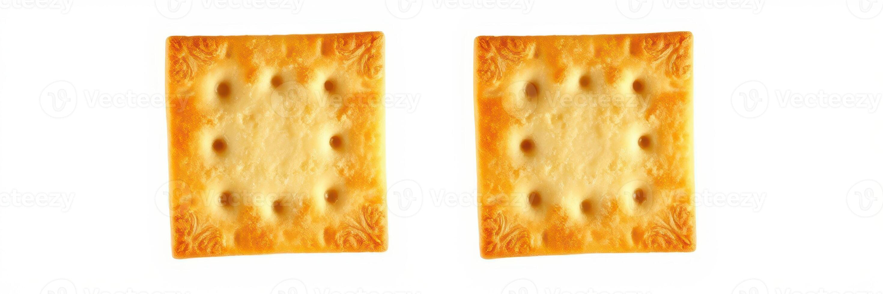 Two square crackers placed side by side on a white background showcasing their texture and shape details photo