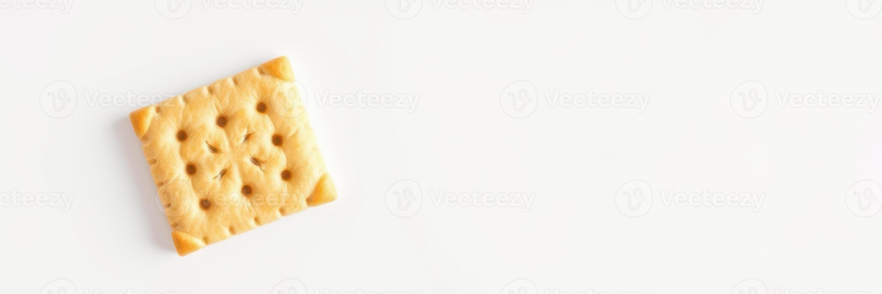 Unique cracker prominently displayed on a white background, highlighting texture and design at midday photo