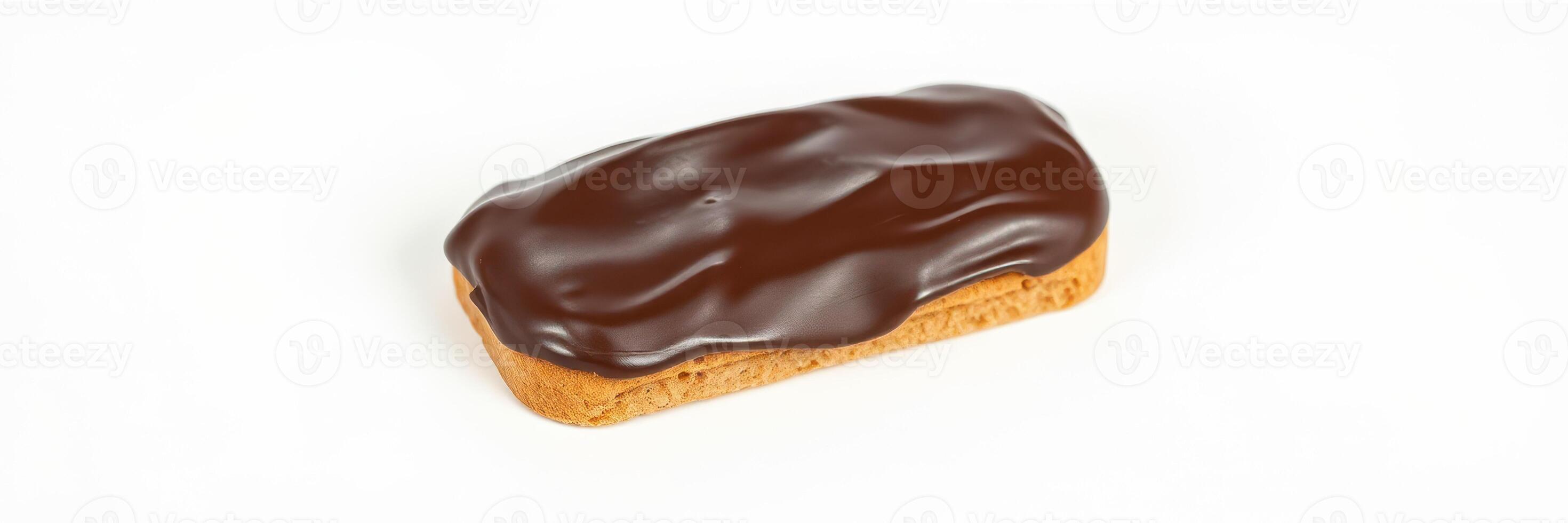 Delicious chocolate eclair with glossy glaze presented on a white surface ready for dessert lovers and pastry enthusiasts photo