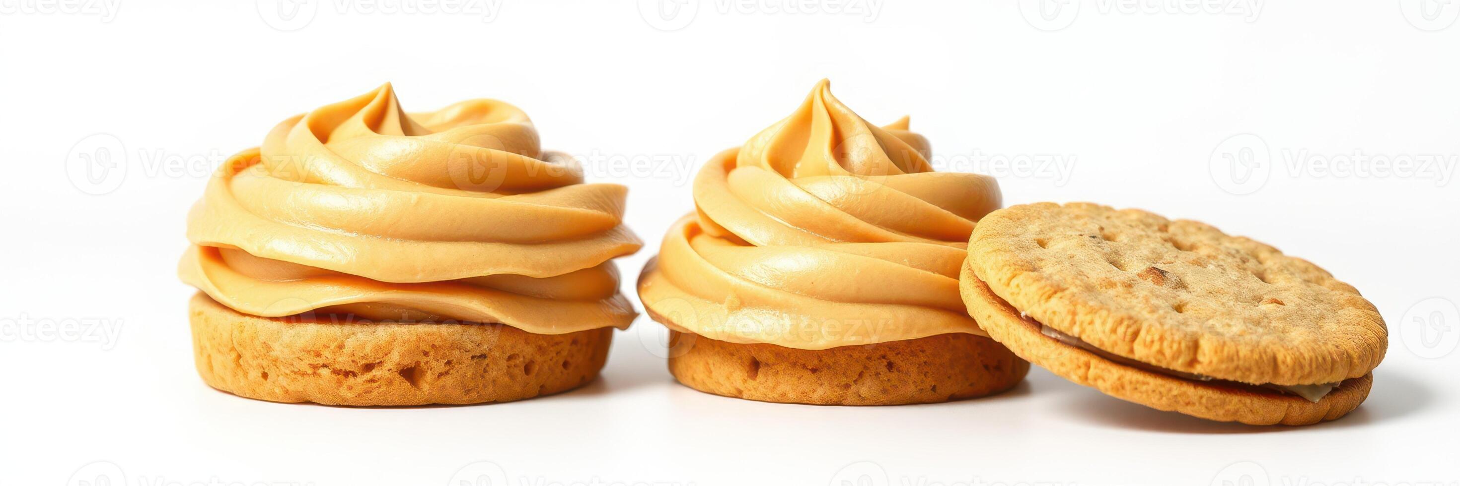 Delicious caramel frosting topped cookies arranged on a white background photo