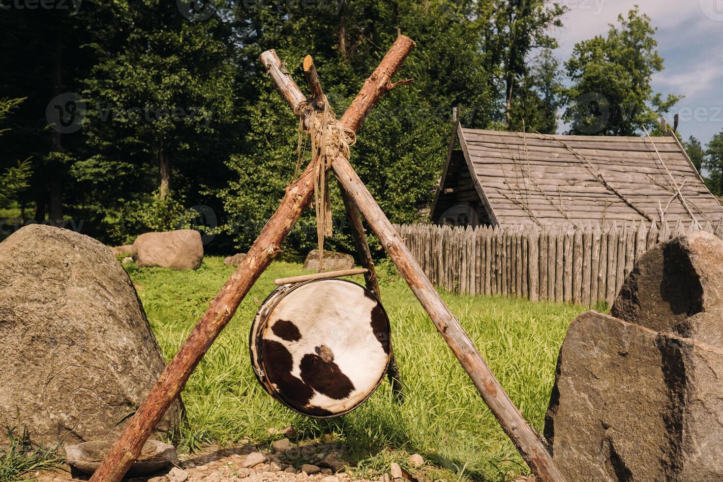 An old traditional drum with fur hanging in a medieval village photo