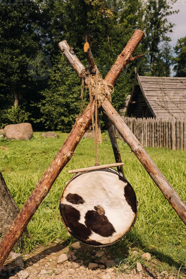 An old traditional drum with fur hanging in a medieval village photo