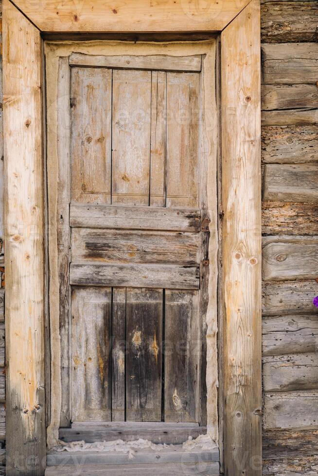wooden barn door with handle. old wooden buildin photo