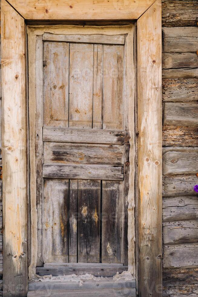 wooden barn door with handle. old wooden buildin photo