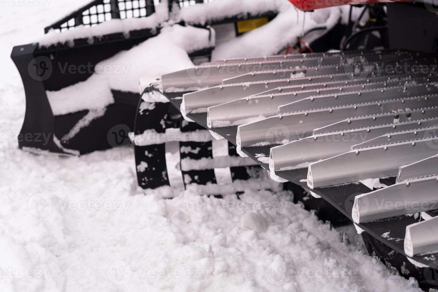 Metal tracks of a snowplow car in winter in the snow photo