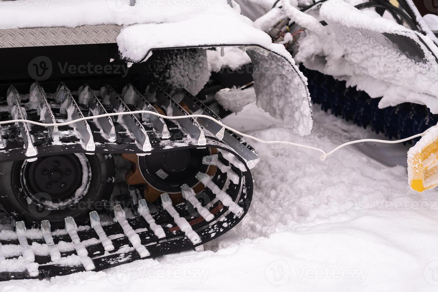 Metal tracks of a snowplow car in winter in the snow photo
